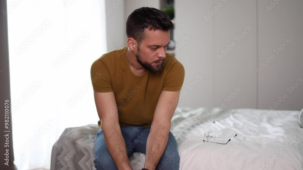 Depressed man holding a box of medicine Depressed man holding a box of medicine