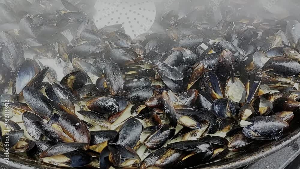 Steaming mussels in a bustling kitchen during a vibrant seafood feast Steaming mussels in a bustling kitchen during a vibrant seafood feast