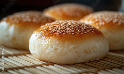 A close up of a sesame seed bun with a brown crust