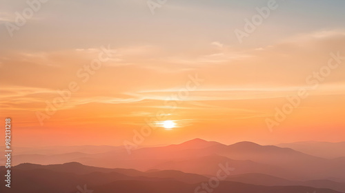 Silhouettes of Mountain Ranges with a Hazy Sunset