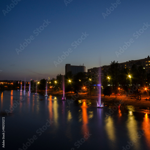 Kyiv night cityscape, color fountain on the embankment of Dnipro river, Rusanivka historical district, capital of Ukraine  2