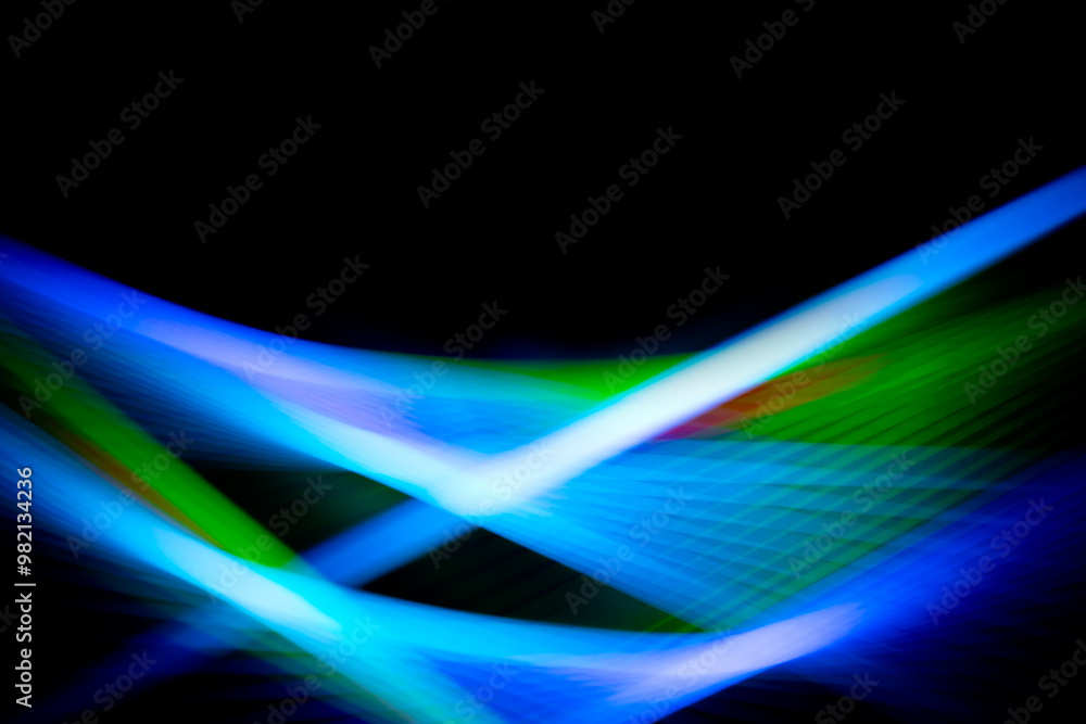 Abstract blurry background with blue and black colors. Freeze light photo effect. Wallpaper with vibrant motion colours Abstract blurry background with blue and black colors. Freeze light photo effect. Wallpaper with vibrant motion colours