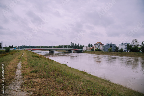 A river flood on Odra in Opole, one of the largest rivers in Poland. Residential buildings, with a risk of being flooded, on a background