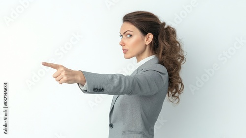 A woman in a business suit pointing to the right