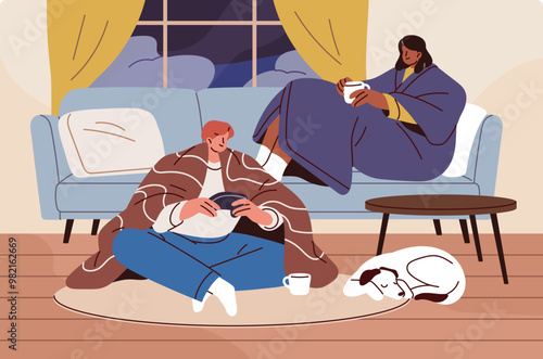 Frozen couple with dog stays at home together in cold weather. Friends sit on sofa, play video games, drink coffee in winter frost. People freeze, warm up under blankets. Flat vector illustration
