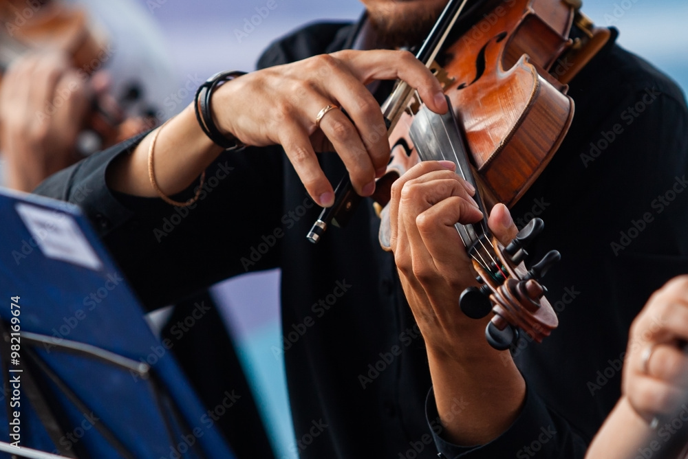 Close-up of violinist's hands in orchestra Close-up of violinist's hands in orchestra
