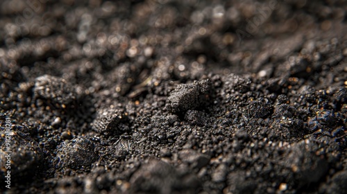 Close-up image of black volcanic ash. A texture for a background or to represent the devastation of a volcanic eruption. photo