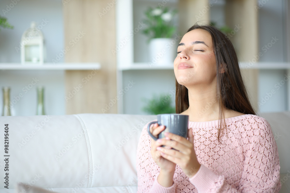 Woman relaxing drinking coffee and breathing at home Woman relaxing drinking coffee and breathing at home