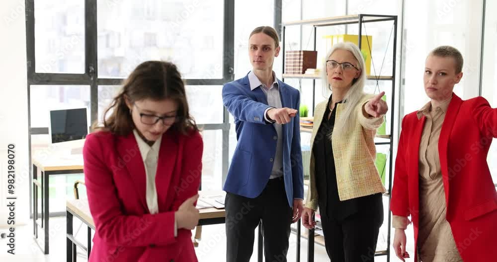 Young sad woman leaving office. Office team escorts colleague and points to exit concept Young sad woman leaving office. Office team escorts colleague and points to exit concept