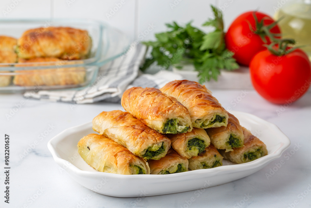 Turkish Tepsi Boregi, Round Borek, Tray pastry (Turkish name; rulo borek - sigara boregi). Spinach Pie Turkish Tepsi Boregi, Round Borek, Tray pastry (Turkish name; rulo borek - sigara boregi). Spinach Pie