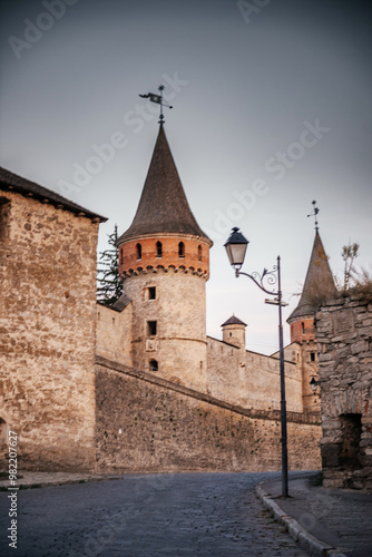 Close-Up of Kamyanets-Podilskyi Castle Towers and Cobblestone Street photo