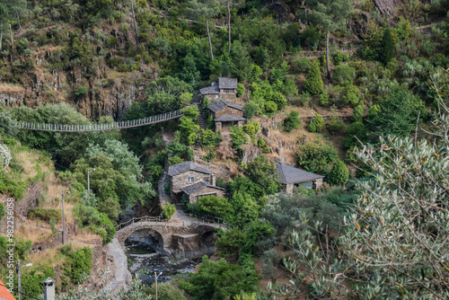 Famous schist village of Foz d'Égua in valley with stone bridge over stream, Arganil PORTUGAL