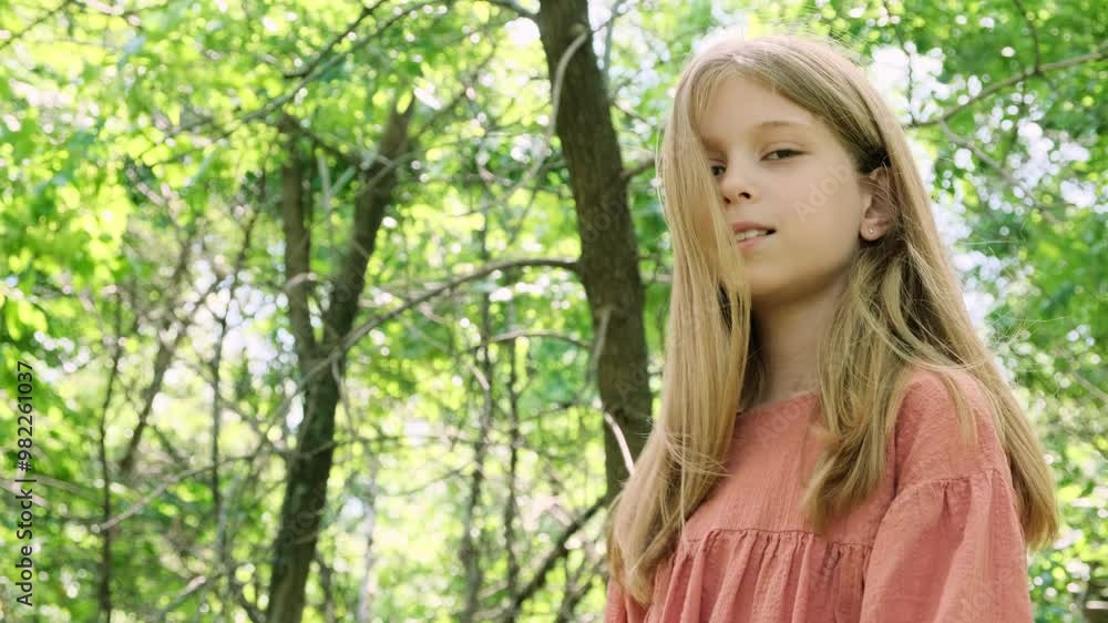 Portrait of a girl with long hair against the backdrop of nature. Portrait of a girl with long hair against the backdrop of nature.