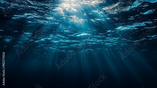 Underwater Sunbeams Illuminating Dark Blue Ocean Depths