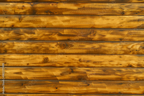 Surface of wall with burnt and brushed split log siding photo