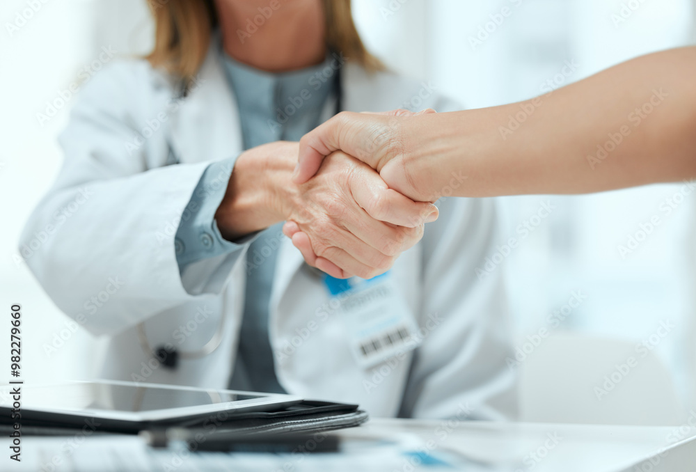 © KayExam/peopleimages.com - Consulting, doctor and handshake with people in hospital office for medical agreement or meeting. Deal, interview or partnership with healthcare professional and patient shaking hands in clinic