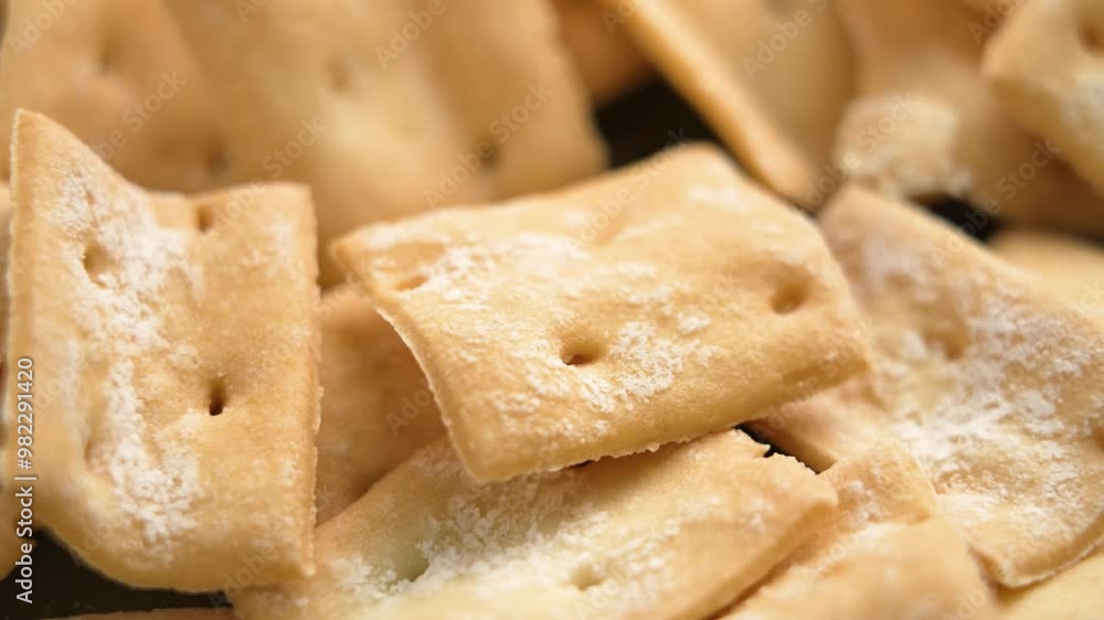 Delicious homemade crackers with satisfying crunch and rich flavor falling in slow motion. Macro shot Delicious homemade crackers with satisfying crunch and rich flavor falling in slow motion. Macro shot