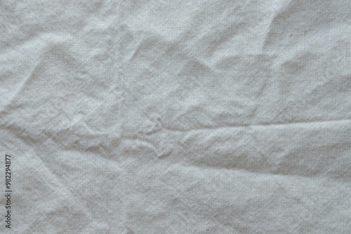 Wallpaper Mural Grey textile napkin in white color as background. Folded decorative kitchen cotton towel Torontodigital.ca