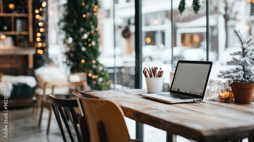 Open office space decorated for Christmas holidays with trees and ornaments, creating warm and festive atmosphere at workplace