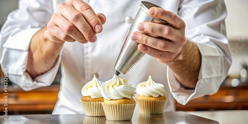 The chef refills a metal cup with a piping bag filled with rich cream, precision pouring a generous photo