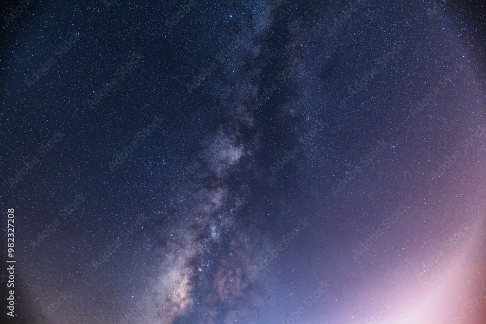 A breathtaking view of the Milky Way stretching across the night sky above a calm sea. The starry band of our galaxy is visible in all its glory. Suao, Yilan County, Taiwan. A breathtaking view of the Milky Way stretching across the night sky above a calm sea. The starry band of our galaxy is visible in all its glory. Suao, Yilan County, Taiwan.
