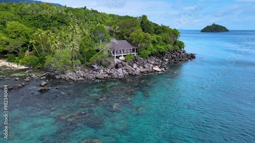 Tropical Island Bungalow with a View of the Emerald Green Sea