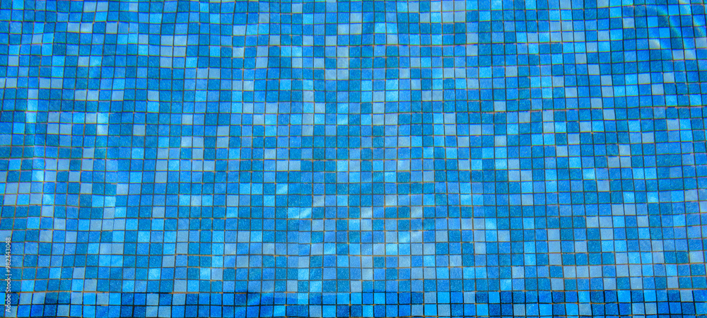 Swimming pool water surface and ripple wave with blue mosaic tiles Swimming pool water surface and ripple wave with blue mosaic tiles