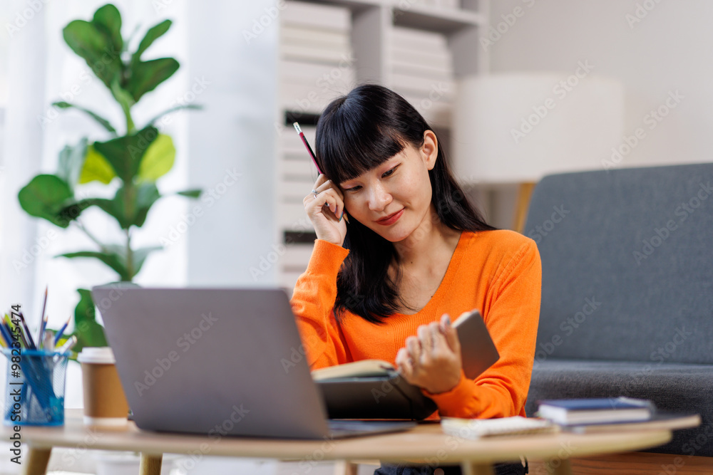 Focused young asian businesswoman write in notebook, learning, using laptop. Concept of remote work, studying with computer
Focused young asian businesswoman write in notebook, learning, using laptop. Concept of remote work, studying with computer