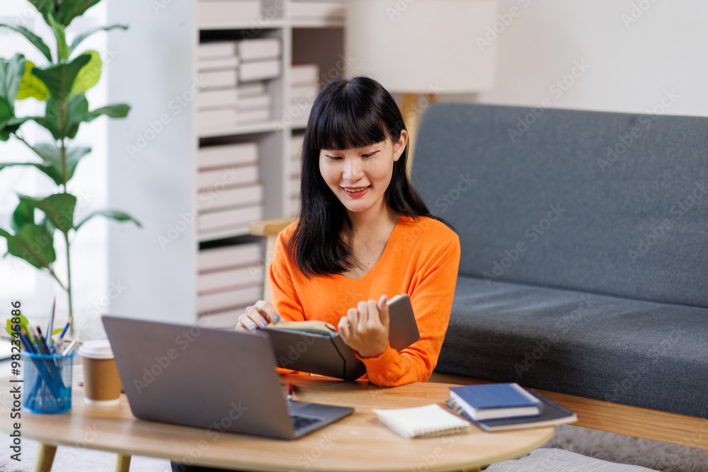 Focused young asian businesswoman write in notebook, learning, using laptop. Concept of remote work, studying with computer
Focused young asian businesswoman write in notebook, learning, using laptop. Concept of remote work, studying with computer