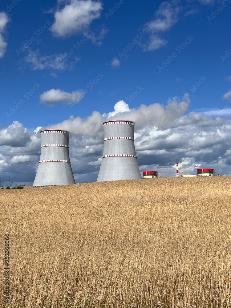 cooling towers of a nuclear power plant on a sunny day against a blue sky cooling towers of a nuclear power plant on a sunny day against a blue sky