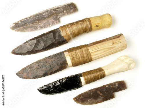 Stone Age Knives with Flintstone and Obsidian Blade isolated on white Background photo