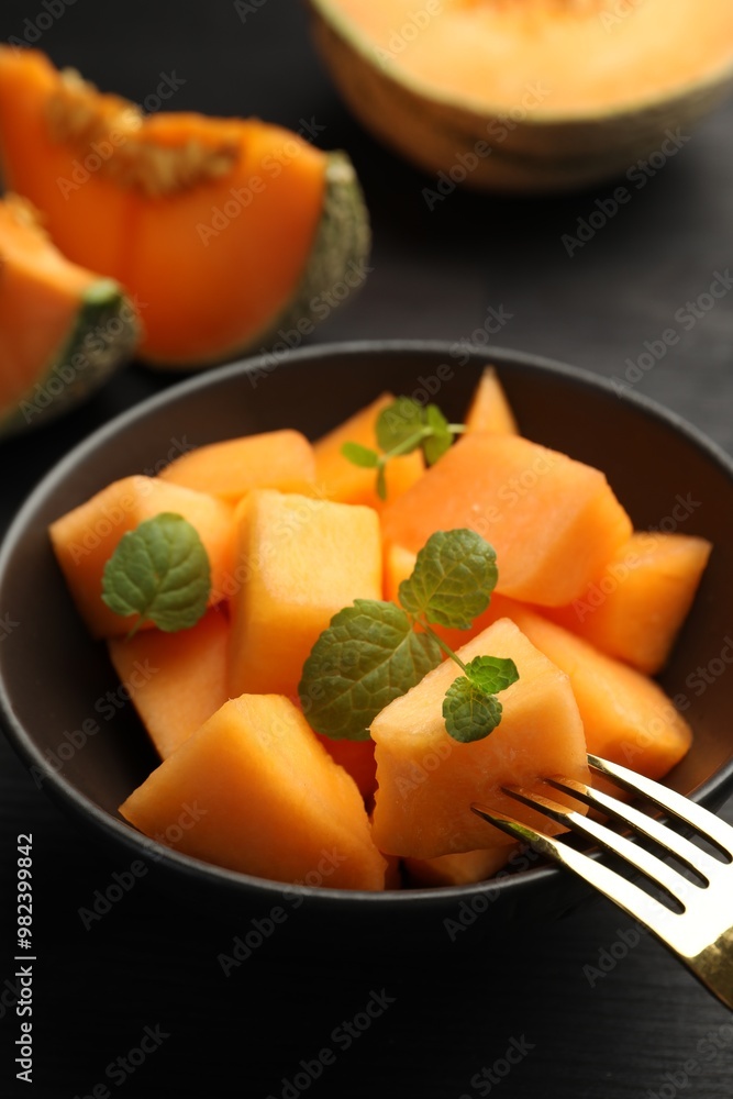 Pieces of ripe Cantaloupe melon in bowl on table, closeup Pieces of ripe Cantaloupe melon in bowl on table, closeup