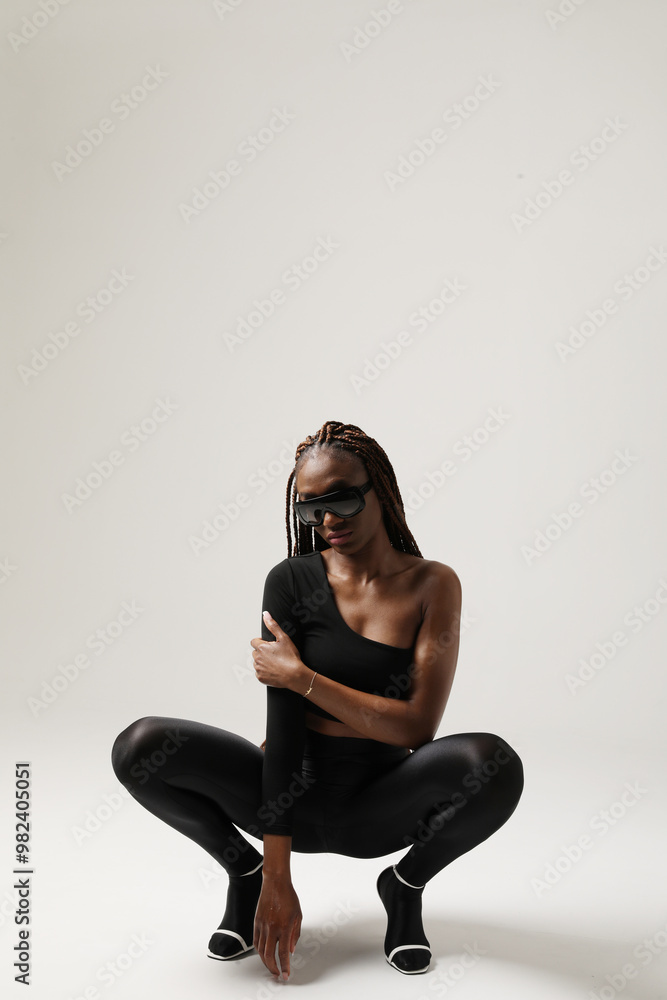 Vertical portrait of young gorgeous African American woman with long braids posing on white background. Vertical portrait of young gorgeous African American woman with long braids posing on white background.