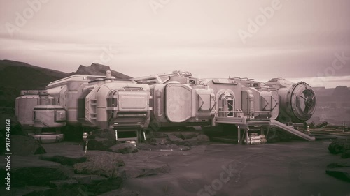 A futuristic colonist base sits on a rocky surface under a hazy sky, indicating a harsh environment. Structures are designed for habitation and research in this remote location.