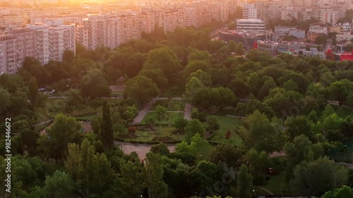 Sunrise over Bucharest. 4K aerial drone video with Crangasi Park next to Morii Lake (Lacul Morii in Romanian), part of Militari neighbourhood. Bucharest from above. photo