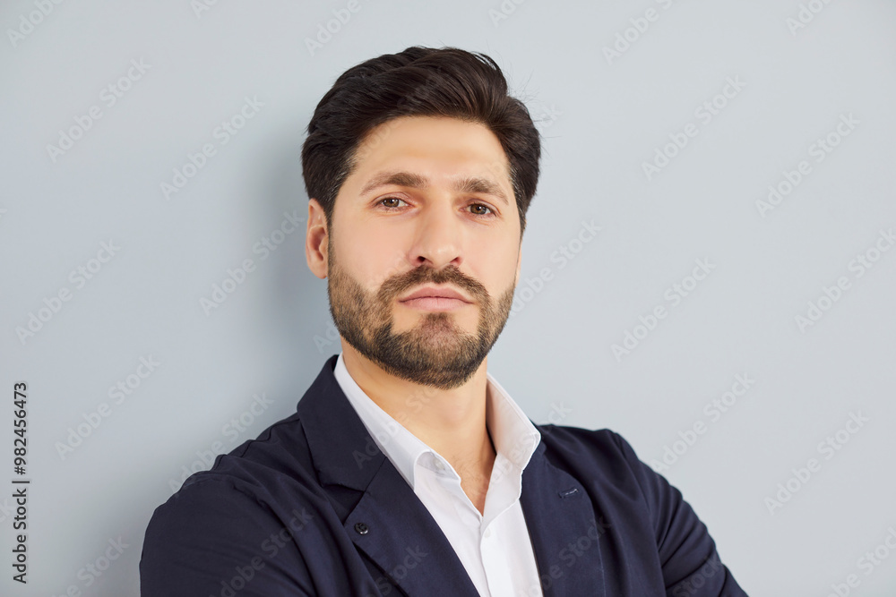 Serious mature bearded male business leader portrait, confident middle aged businessman, handsome CEO, executive in formal suit looking at camera, office wall, posing for corporate photo alone Serious mature bearded male business leader portrait, confident middle aged businessman, handsome CEO, executive in formal suit looking at camera, office wall, posing for corporate photo alone