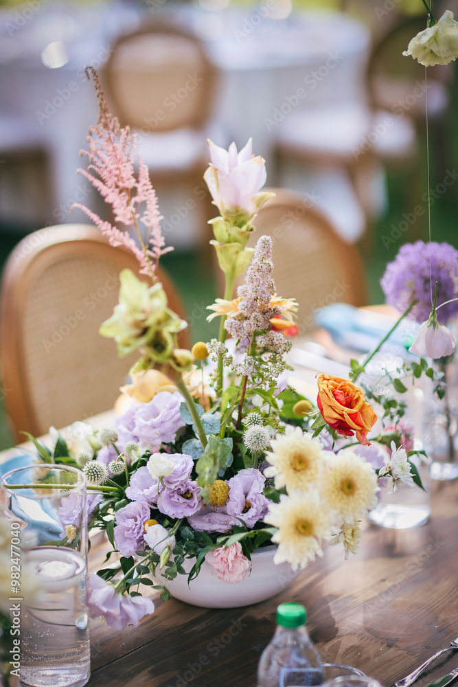 Outdoor Wedding Reception with Brown Chairs and Decorated Tables on a Green Lawn in a Scenic Nature Setting Outdoor Wedding Reception with Brown Chairs and Decorated Tables on a Green Lawn in a Scenic Nature Setting