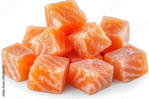 Colorful Orange Candy Cubes on a White Surface photo