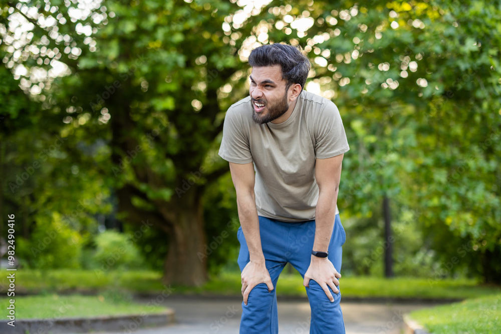 Man engaged in active physical exercises and fitness in the park, showing determination and effort during outdoor workout Man engaged in active physical exercises and fitness in the park, showing determination and effort during outdoor workout