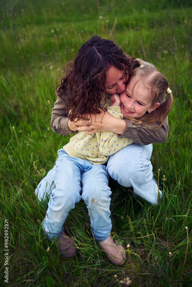 Fototapeta premium mother plays catch up with her daughters
