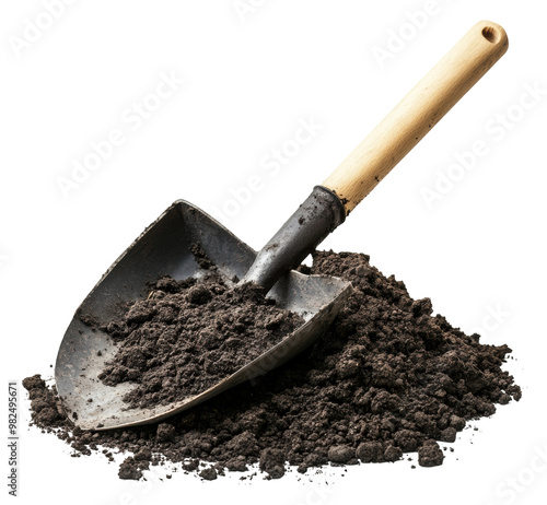 PNG Shovel resting on a pile of dark, rich soil