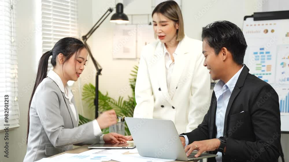 group of business people Asian man working with graphs in the office group of business people Asian man working with graphs in the office