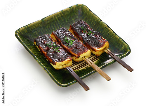 Japanese Kyoto vegetarian cuisine. Namafu Dengaku is made by skewering namafu(wheat gluten), spreading it with black sweet dengaku miso, and grilling it over charcoal.　
 photo