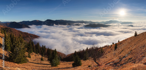 Morning sun panorama, beautiful fluffy clouds and forest at mount Lysec in Slovakia