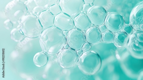 Close-up of bubbles forming ripples on a pastel aqua background.