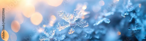 A close-up view of intricate snowflakes glistening in the light, showcasing their unique patterns and the beauty of winter.