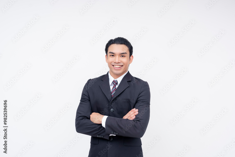 Portrait of an upbeat and ambitious young asian business executive in a fashionable suit and tie. Arms crossed, standing confidently. Isolated on a white background. Portrait of an upbeat and ambitious young asian business executive in a fashionable suit and tie. Arms crossed, standing confidently. Isolated on a white background.