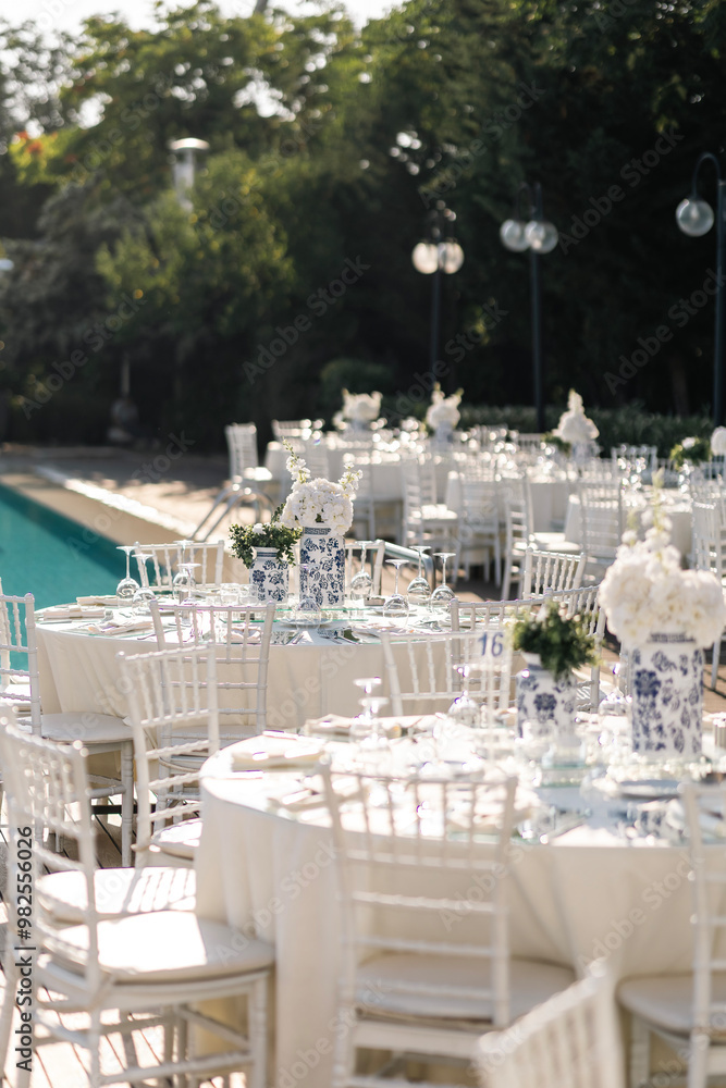 Romantic Wedding Preparation: Rings, Scissors, and Flowers on a Delicate Plate