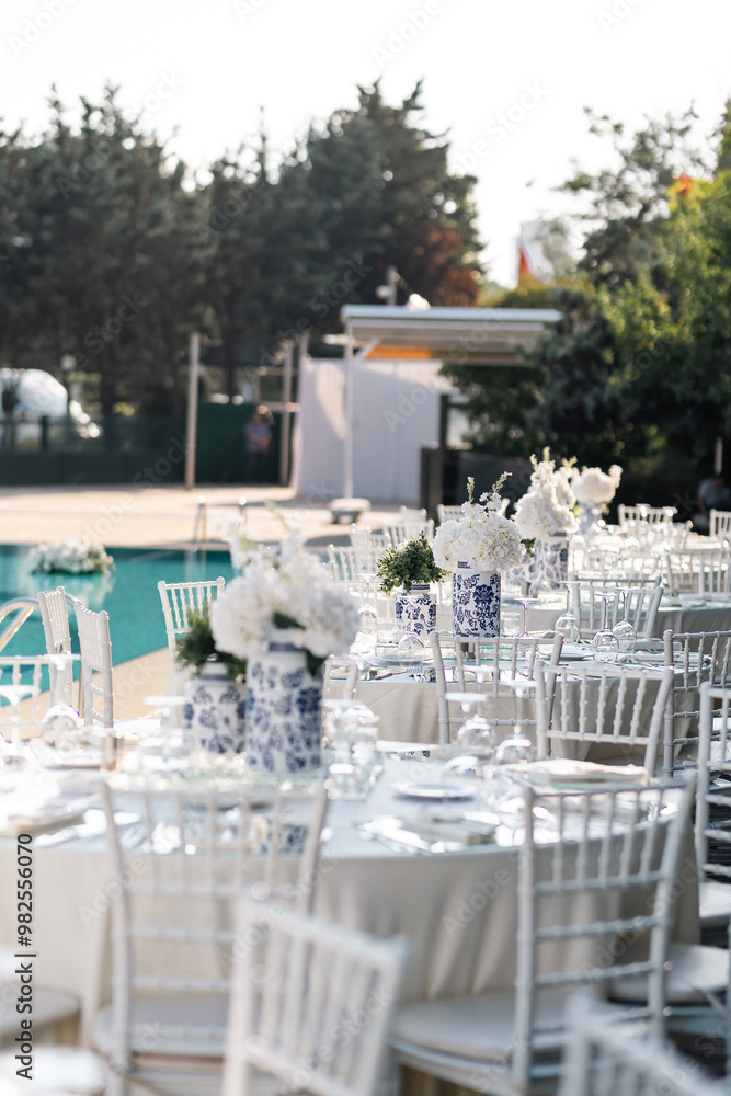 Romantic Wedding Preparation: Rings, Scissors, and Flowers on a Delicate Plate