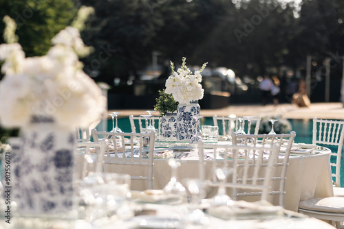 Romantic Wedding Preparation: Rings, Scissors, and Flowers on a Delicate Plate